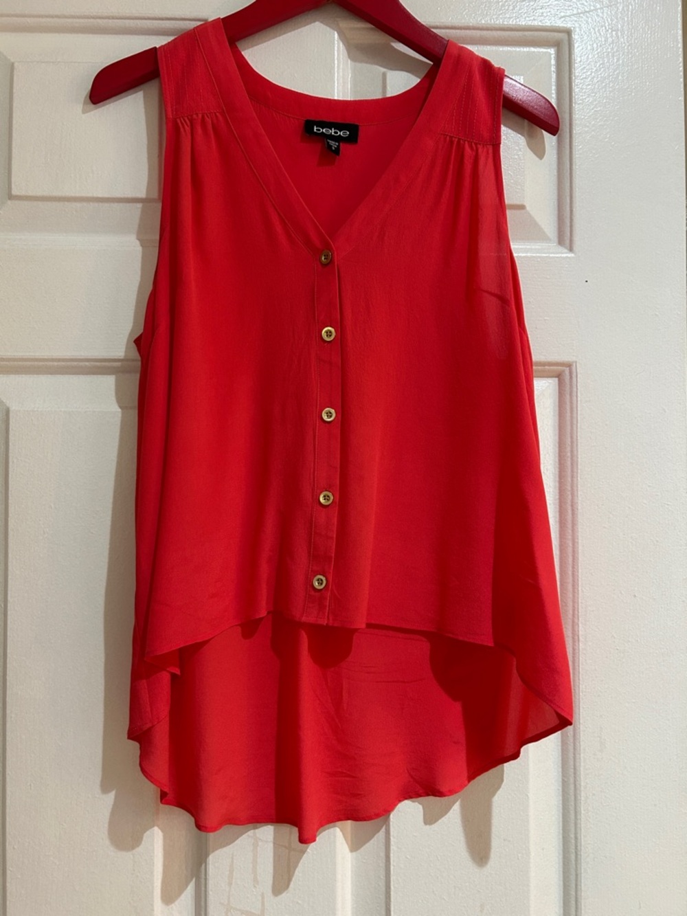 bebe Silk Sleeveless V-Neck High-Low Button Front Camisole.